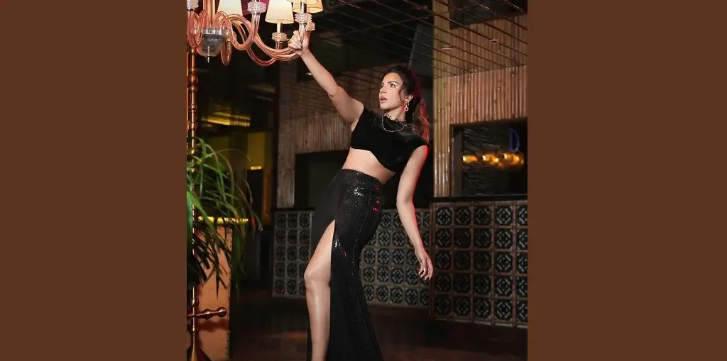 Shama Sikander in a black slit outfit